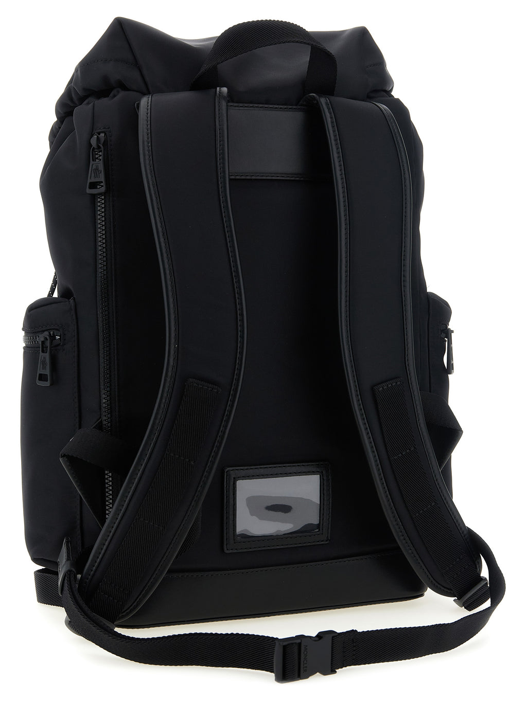 Black backpack shown from the back, featuring padded shoulder straps, a top zip closure, side pockets, and a small rectangular brand patch on the lower back panel.