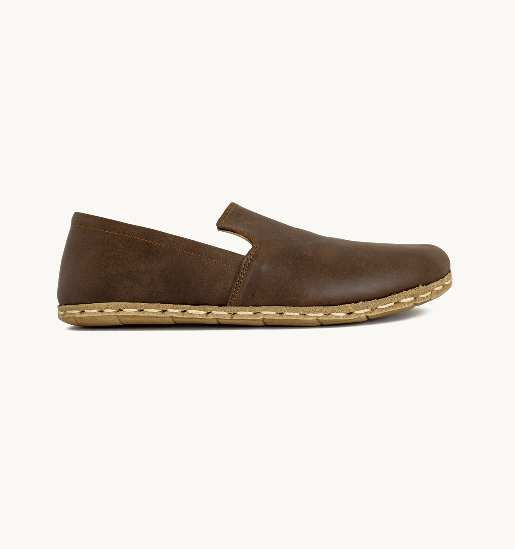 Earth men's barefoot leather loafer, side view — hand-stitched, zero drop