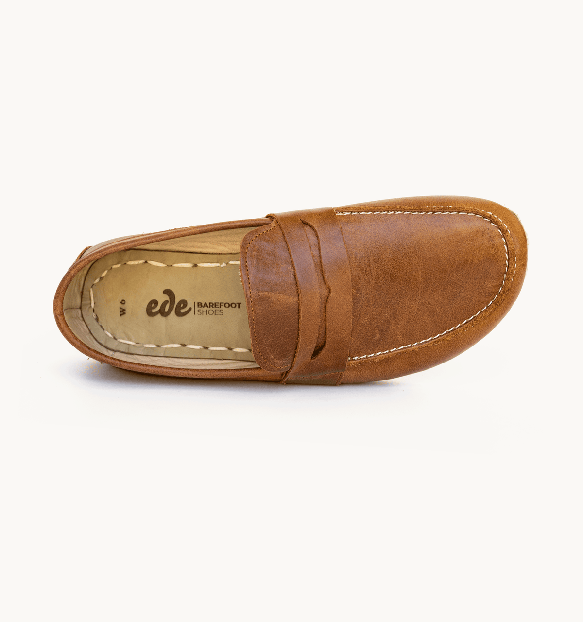Russet women's barefoot leather penny loafer, side view — hand-stitched, zero drop