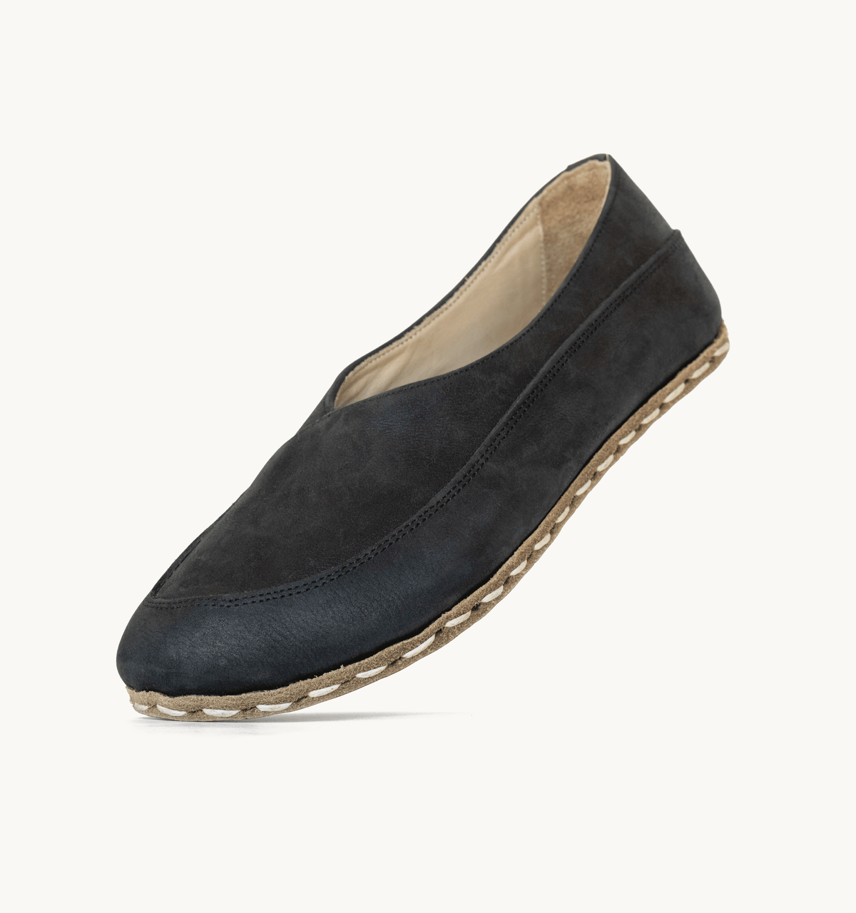 Raven Black women's barefoot leather flat, side view — hand-stitched, zero drop
