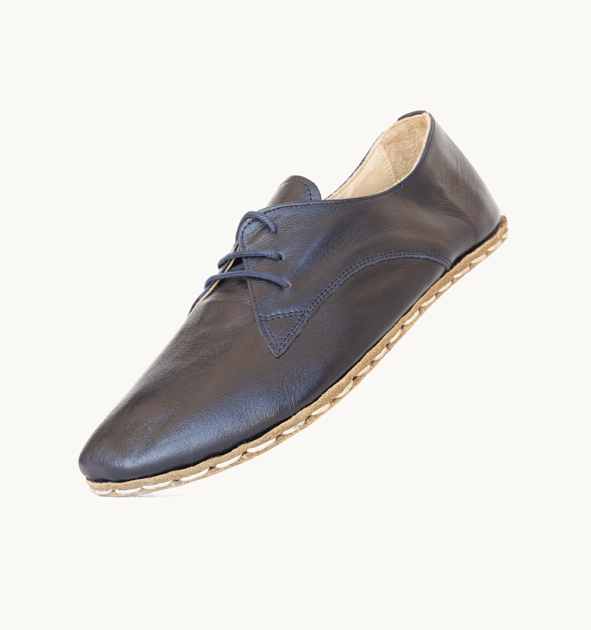 Indigo women's barefoot leather oxford, side view — hand-stitched, zero drop