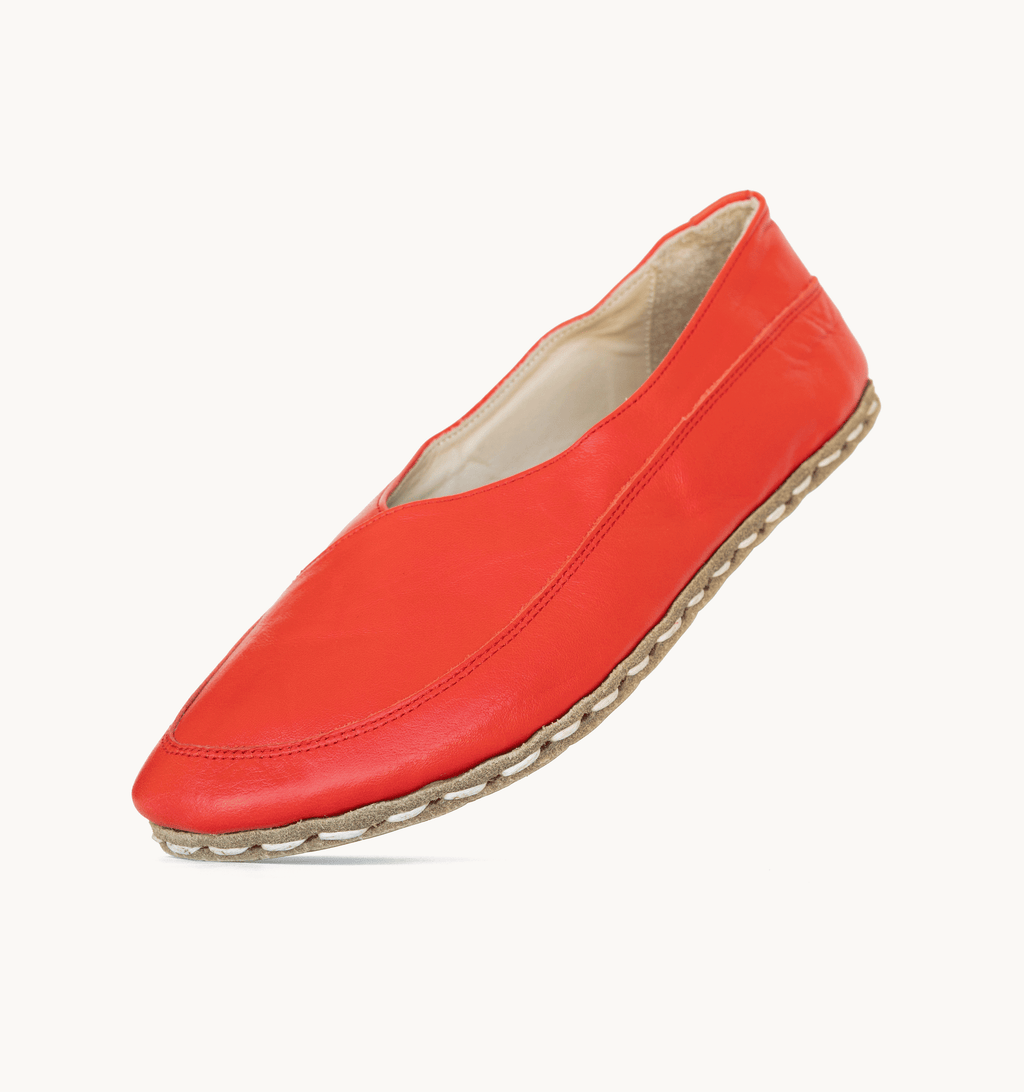 Crimson women's barefoot leather flat, side view — hand-stitched, zero drop