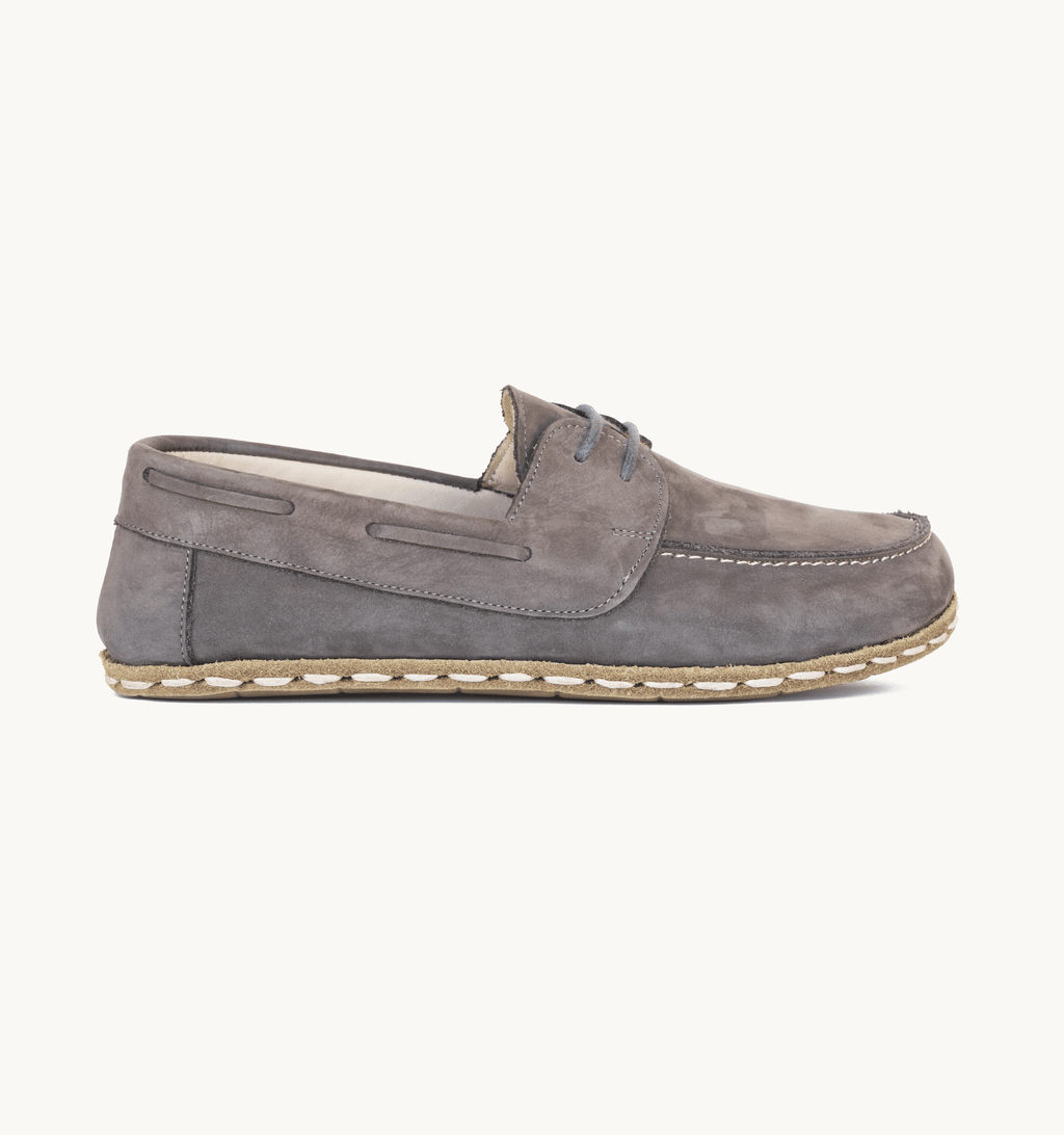 Ashen women's barefoot leather boat shoe, side view — hand-stitched, zero drop