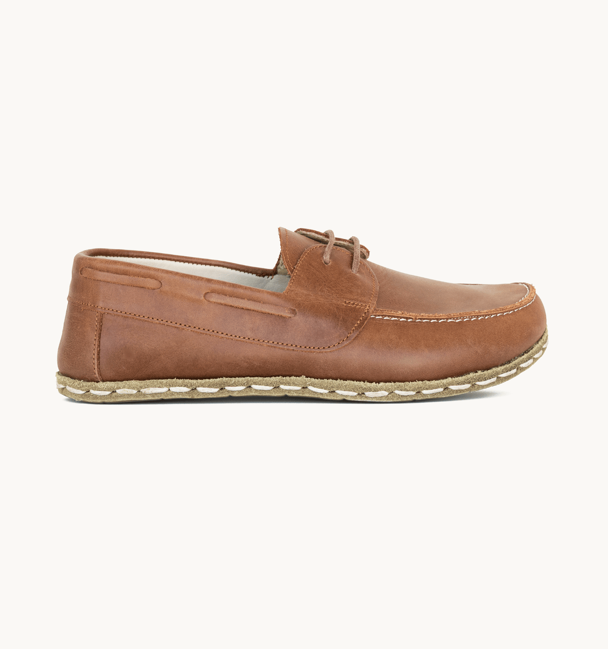 Umber women's barefoot leather boat shoe, side view — hand-stitched, zero drop