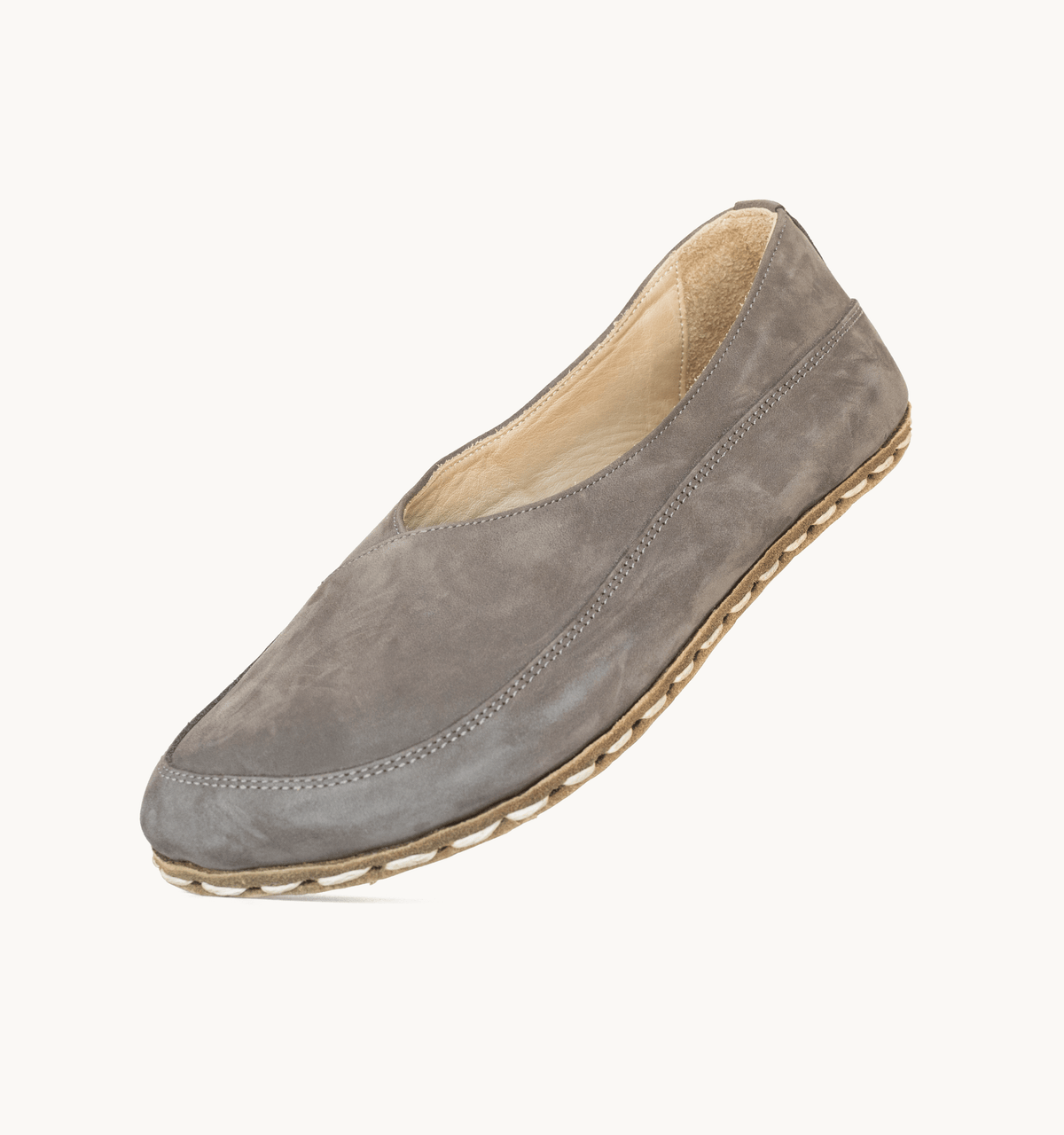 Ashen women's barefoot leather flat, side view — hand-stitched, zero drop