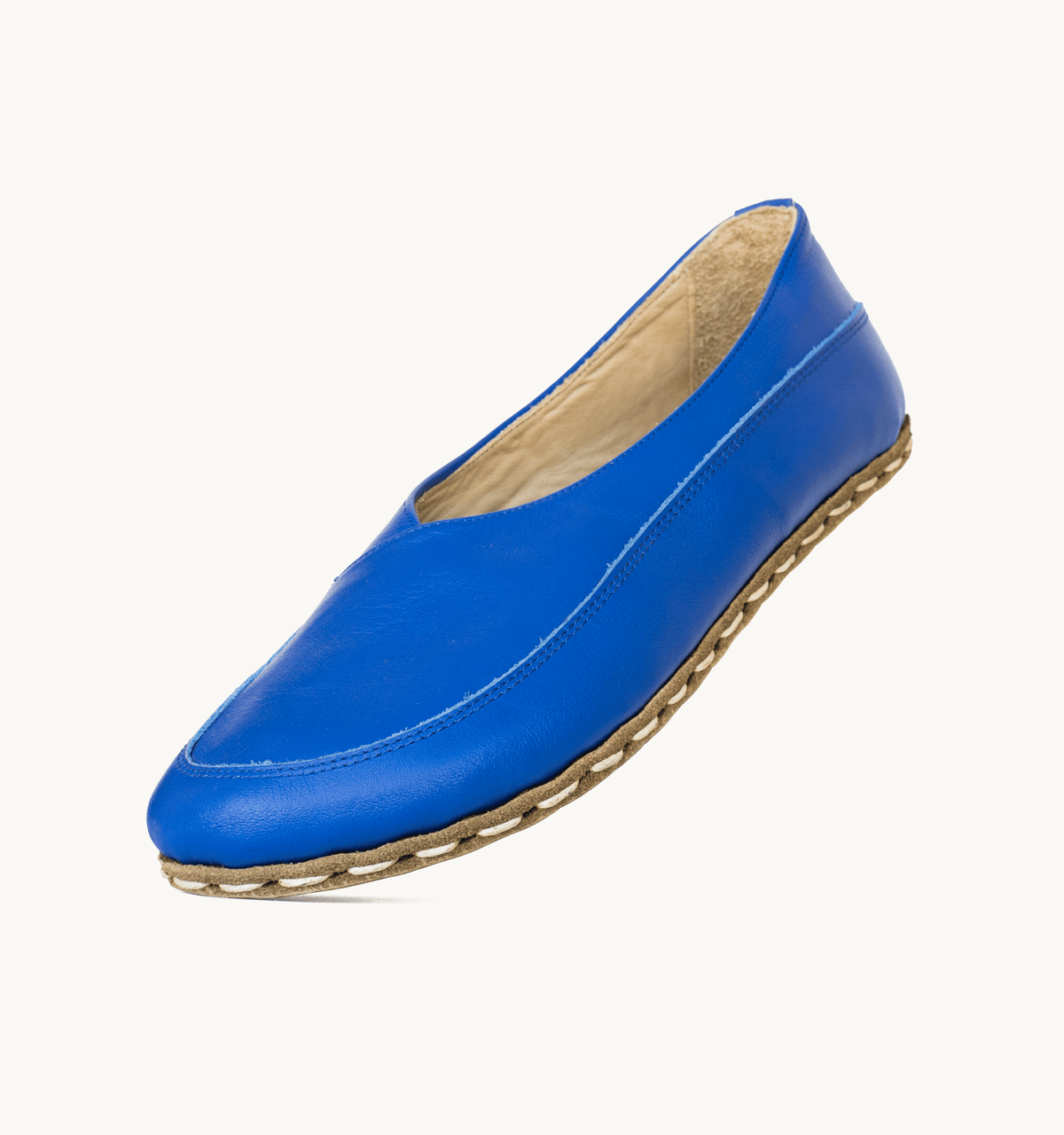 Azure women's barefoot leather flat, side view — hand-stitched, zero drop
