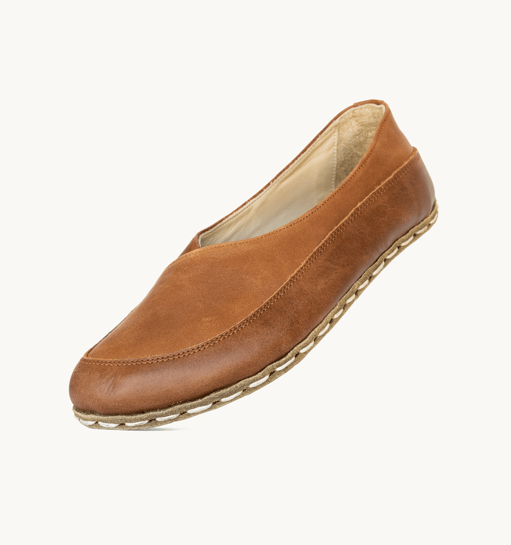 Umber women's barefoot leather flat, side view — hand-stitched, zero drop