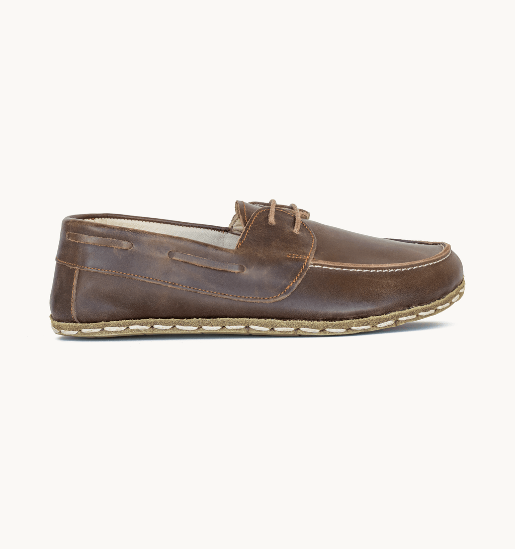 Earth women's barefoot leather boat shoe, side view — hand-stitched, zero drop