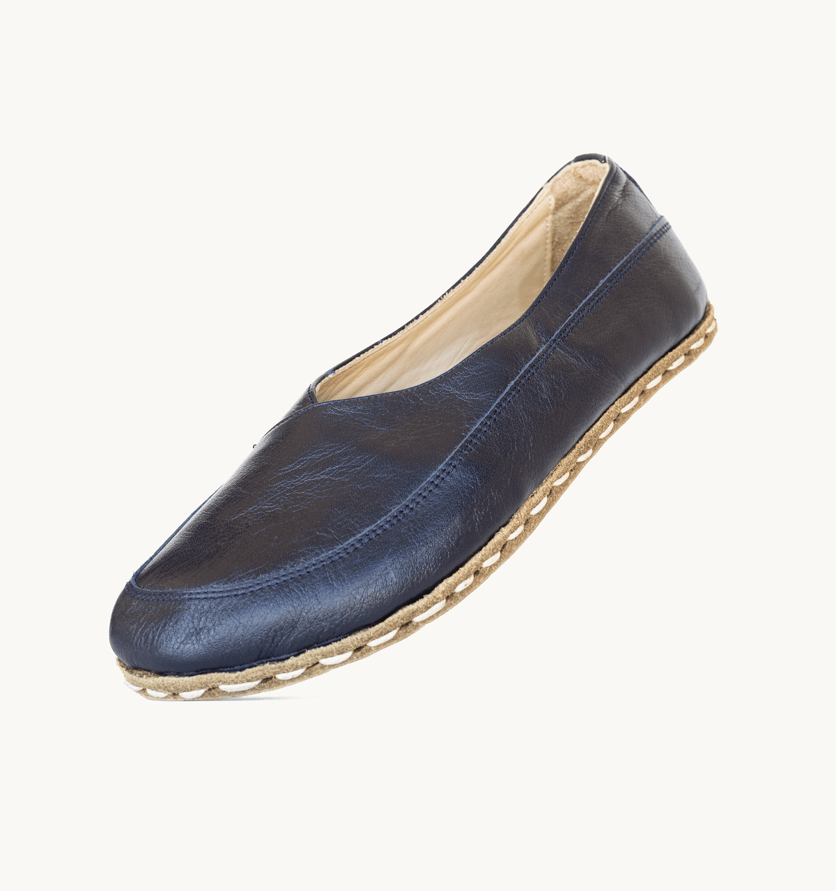 Indigo women's barefoot leather flat, side view — hand-stitched, zero drop