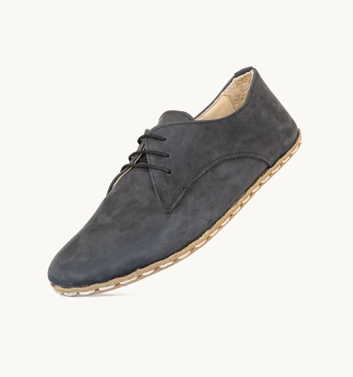 Raven Black men's barefoot leather oxford, side view — hand-stitched, zero drop