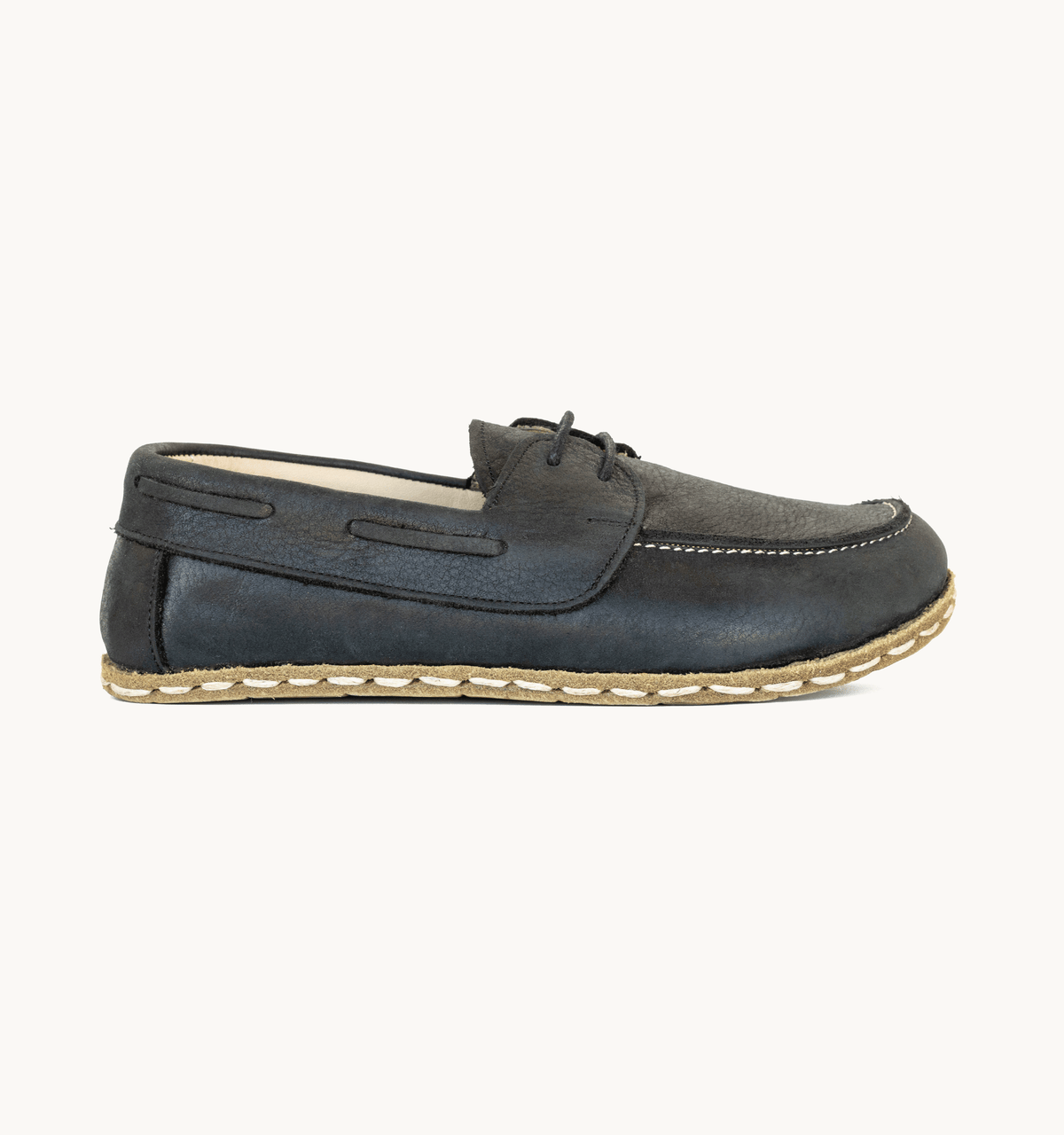 Raven Black women's barefoot leather boat shoe, side view — hand-stitched, zero drop