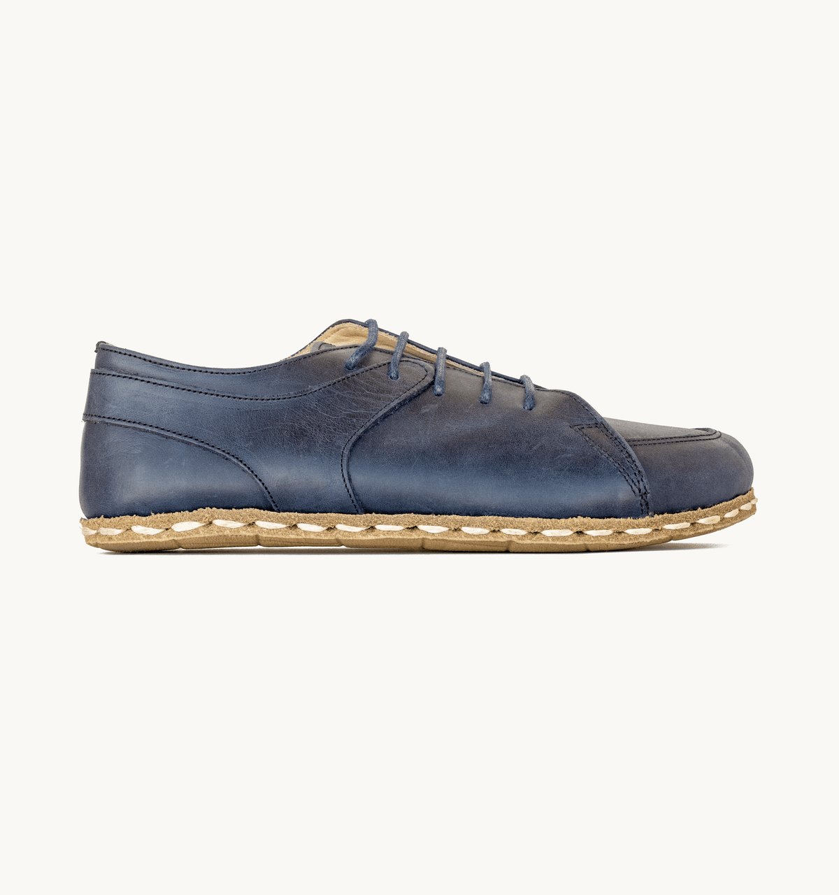 Ocean men's barefoot leather sneaker, side view — hand-stitched, zero drop