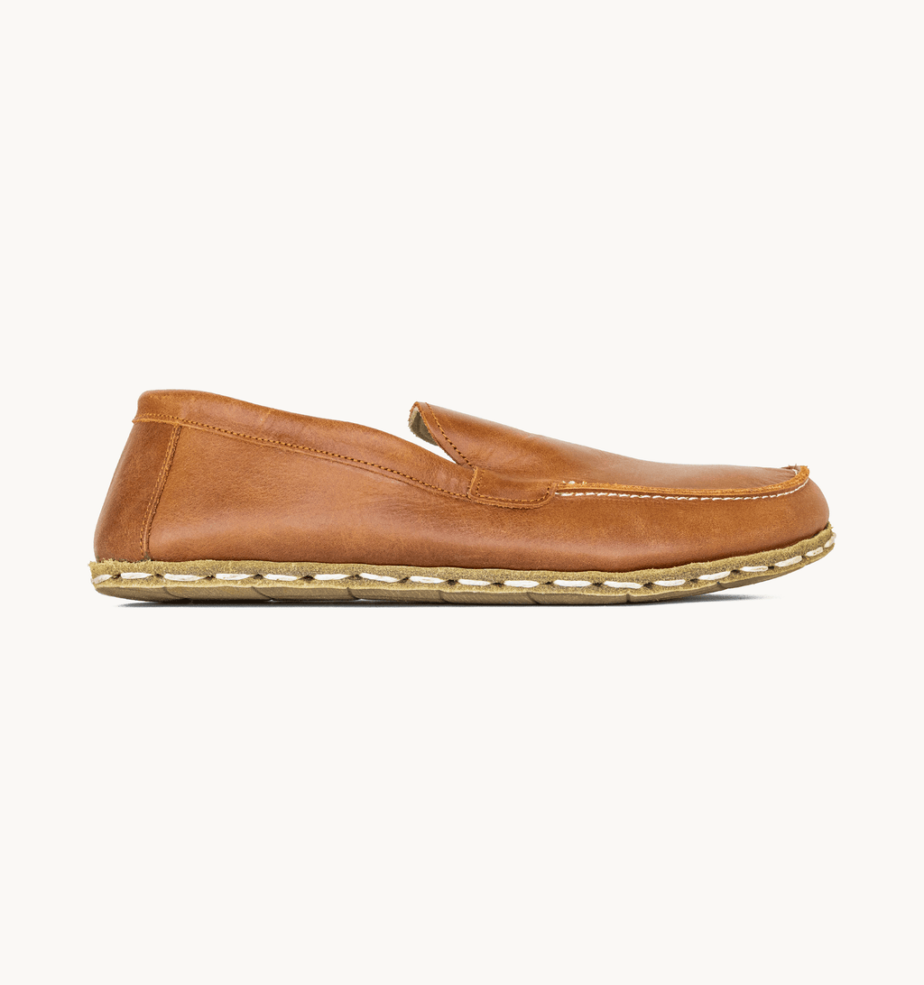 Umber women's barefoot leather moccasin, side view — hand-stitched, zero drop