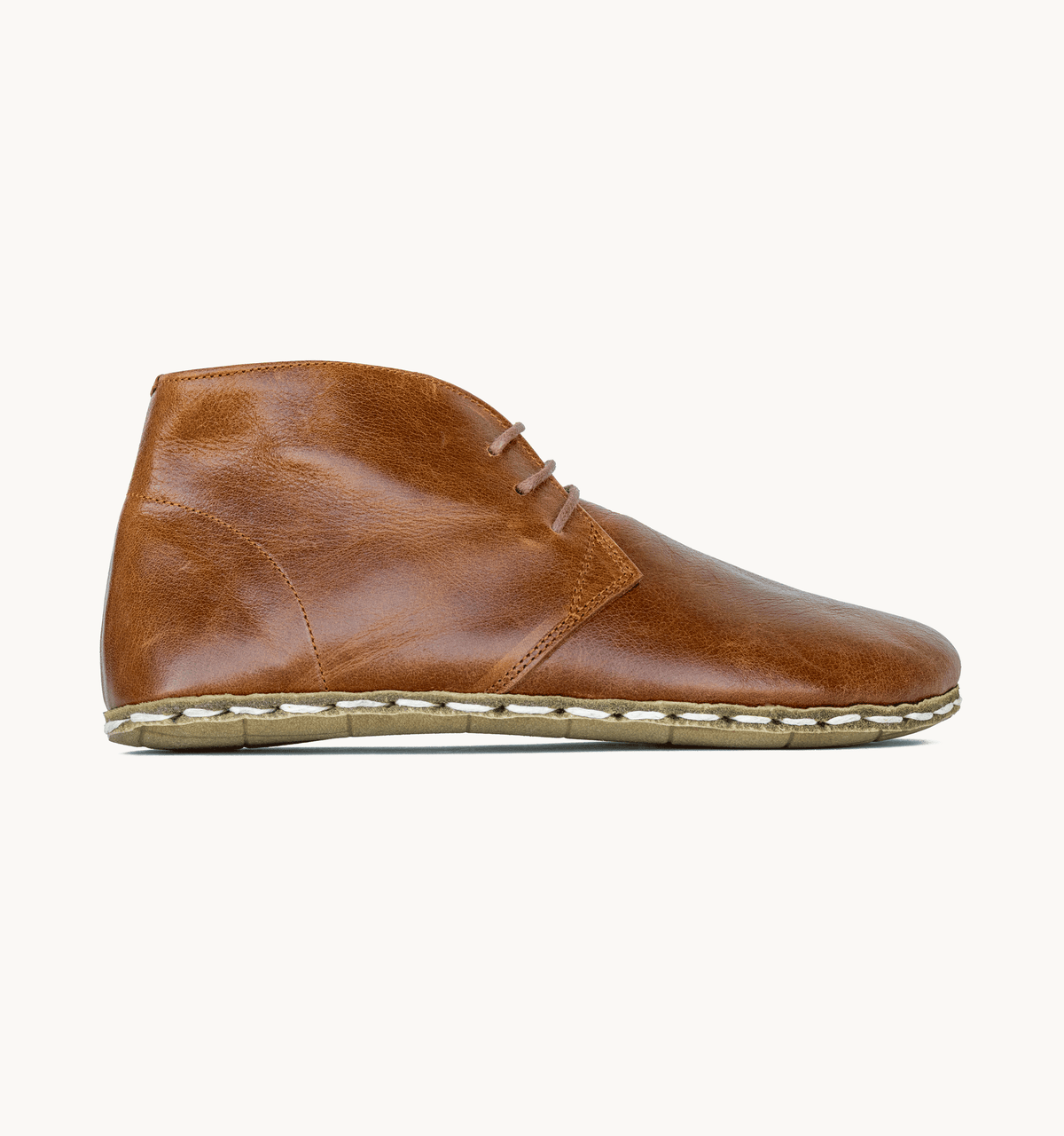 Russet women's barefoot leather chukka boot, side view — hand-stitched, zero drop