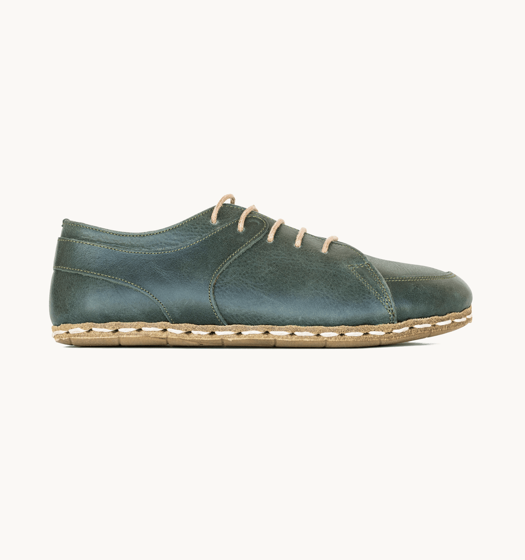 Evergreen men's barefoot leather sneaker, side view — hand-stitched, zero drop