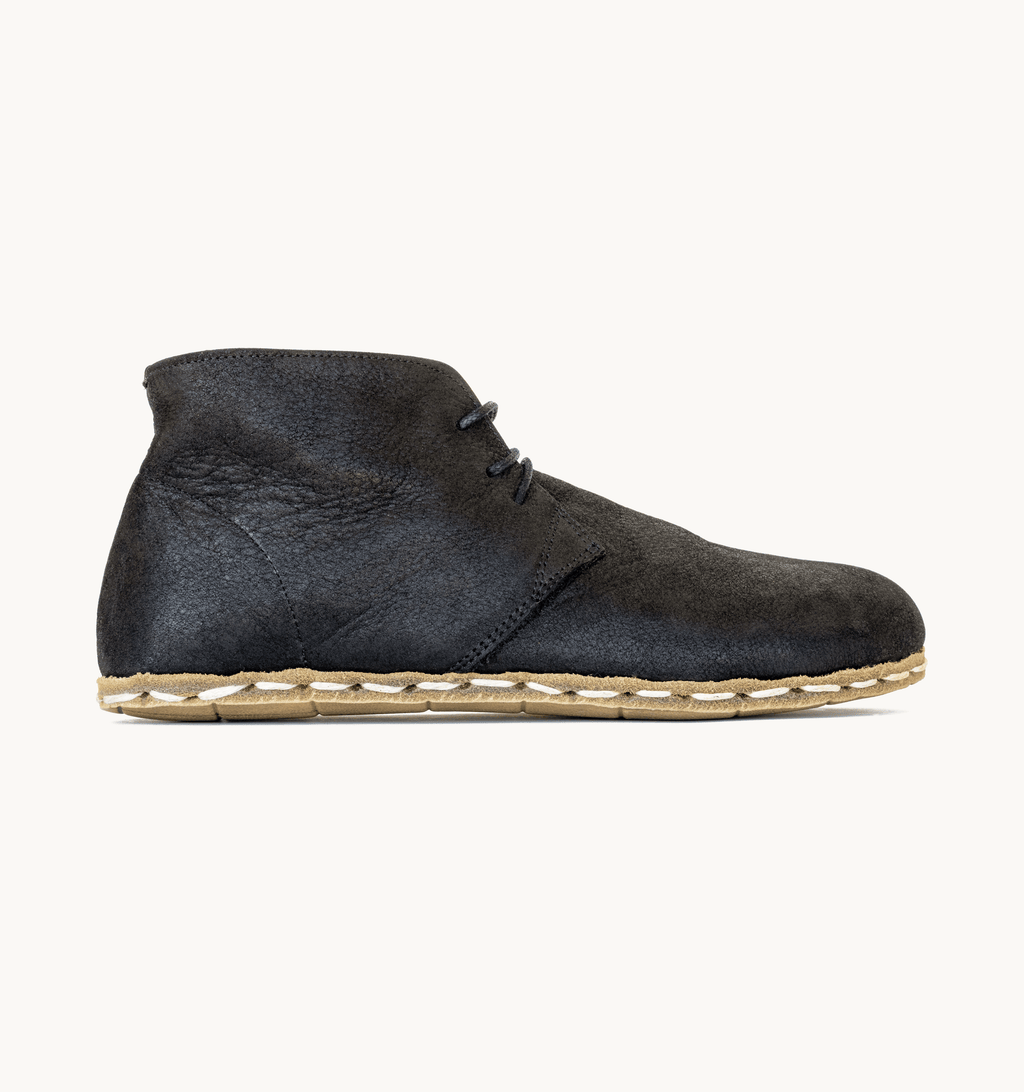 Raven Black men's barefoot leather chukka boot, side view — hand-stitched, zero drop