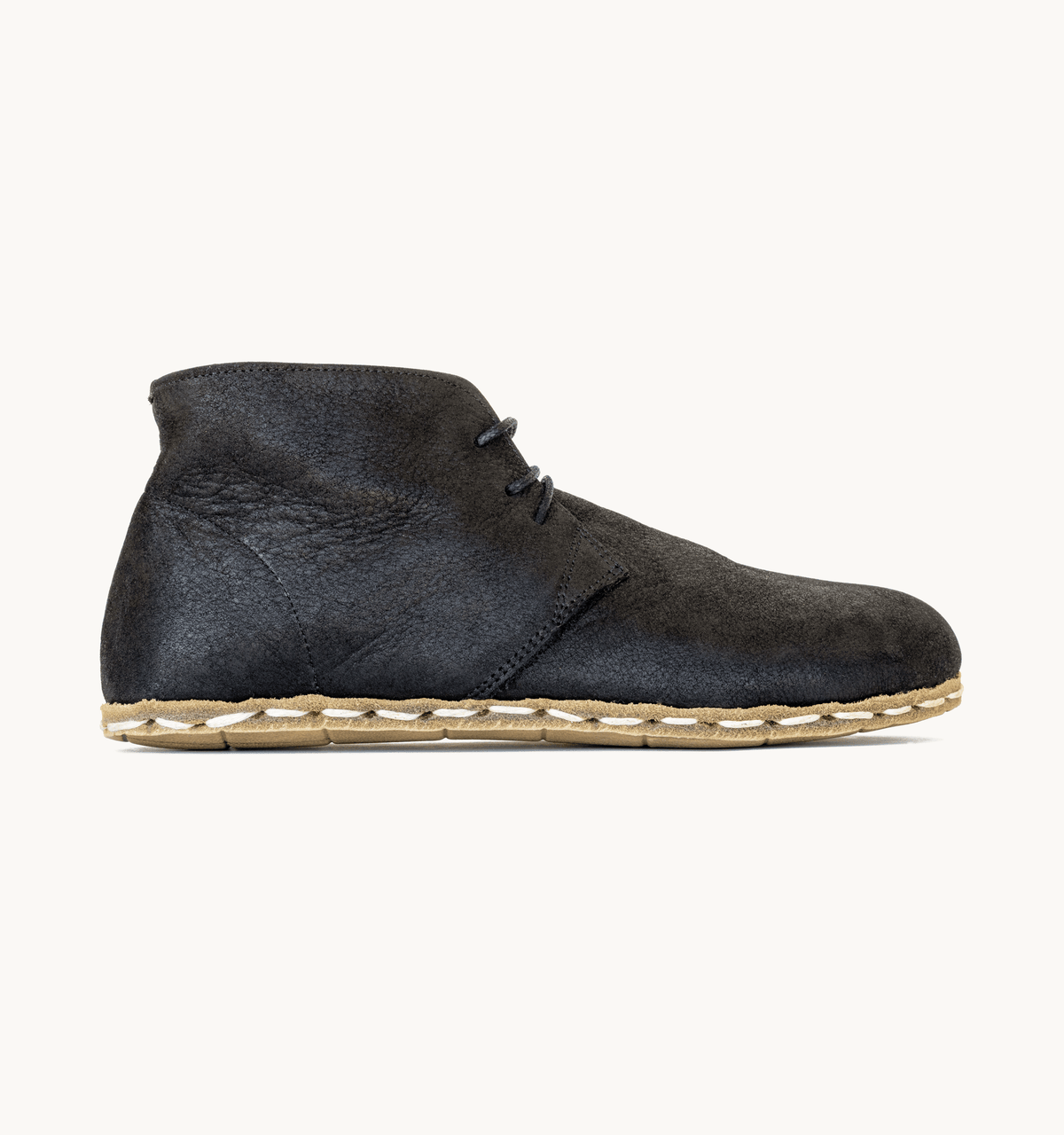Raven Black men's barefoot leather chukka boot, side view — hand-stitched, zero drop