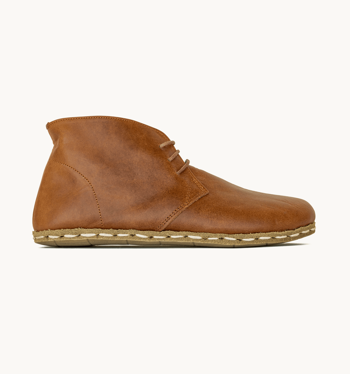 Umber women's barefoot leather chukka boot, side view — hand-stitched, zero drop