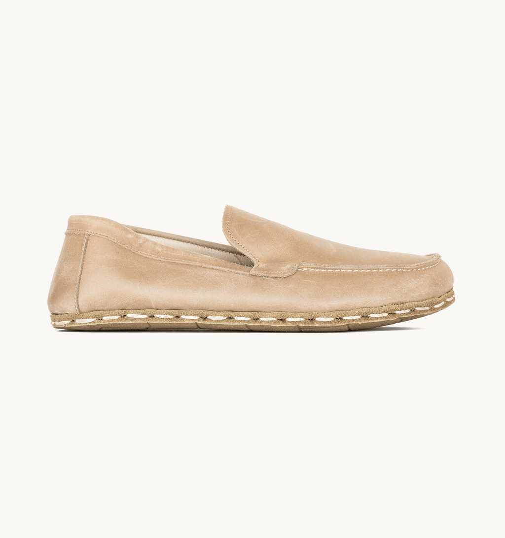 Sand women's barefoot leather moccasin, side view — hand-stitched, zero drop