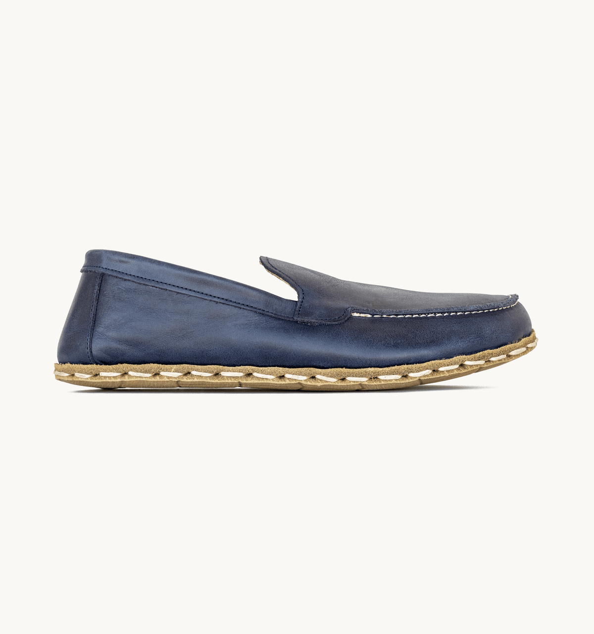 Ocean women's barefoot leather moccasin, side view — hand-stitched, zero drop