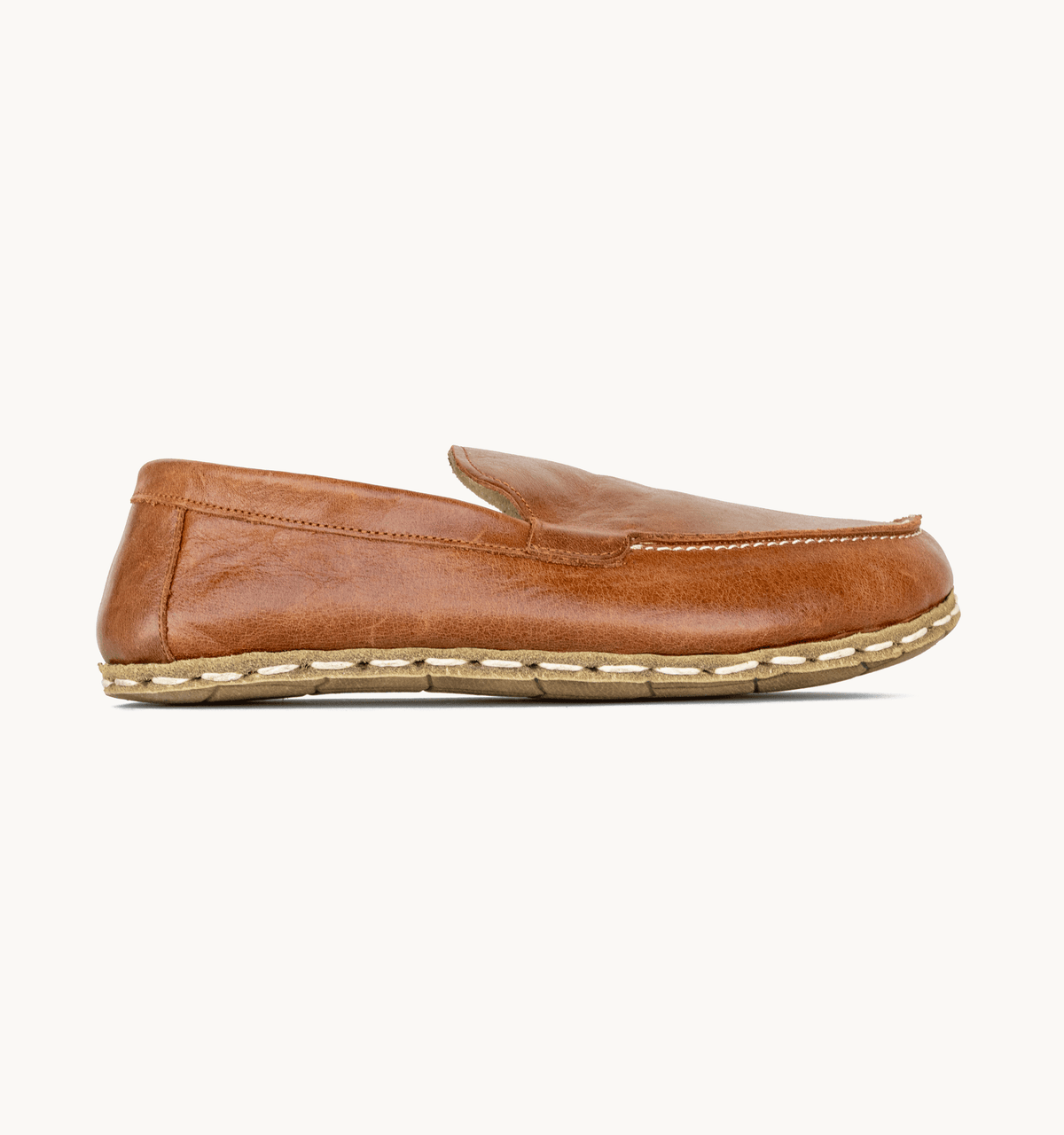 Russet women's barefoot leather moccasin, side view — hand-stitched, zero drop