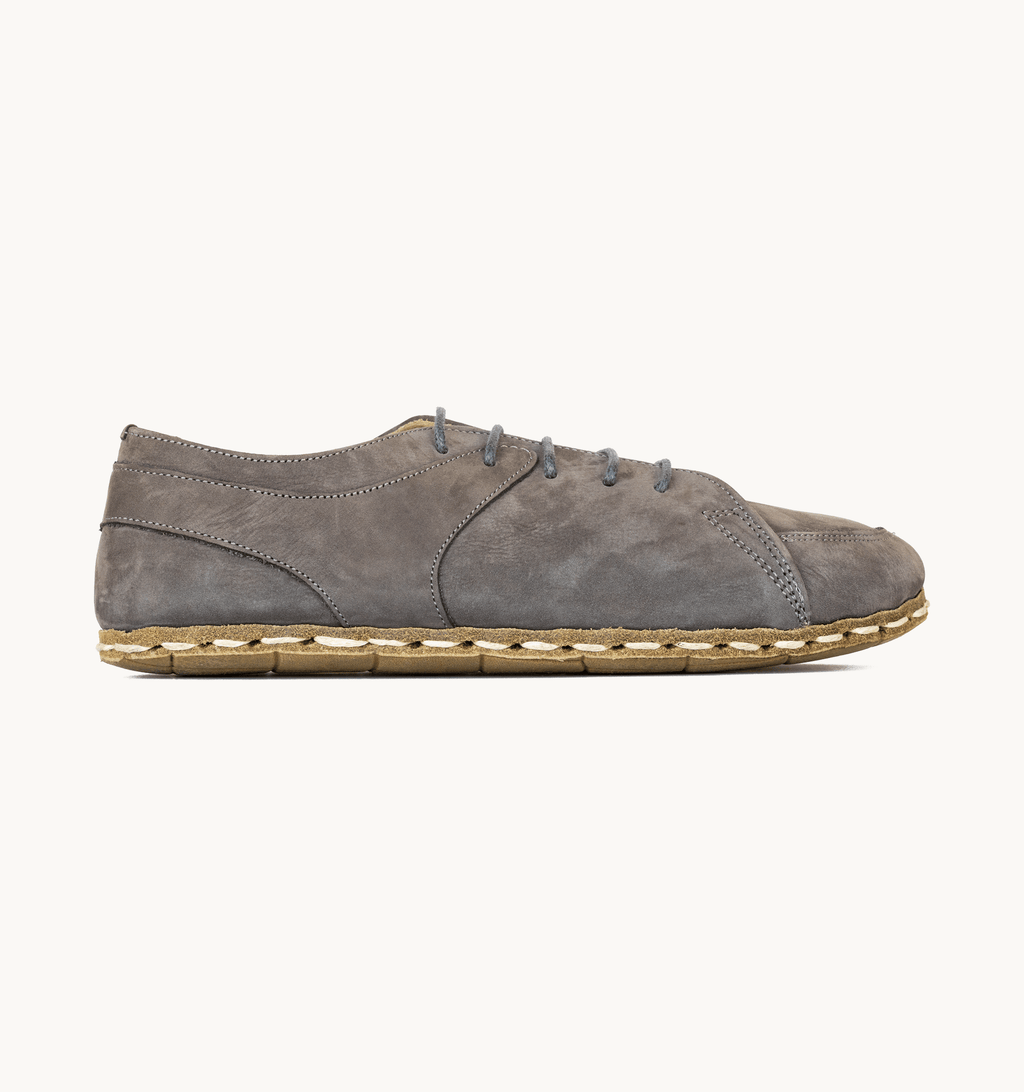 Ashen women's barefoot leather sneaker, side view — hand-stitched, zero drop
