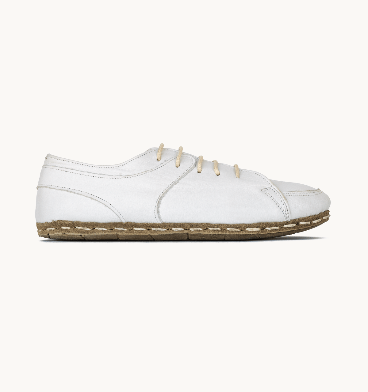 Cloud women's barefoot leather sneaker, side view — hand-stitched, zero drop