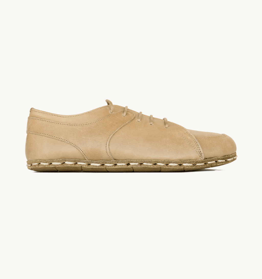 Sand women's barefoot leather sneaker, side view — hand-stitched, zero drop