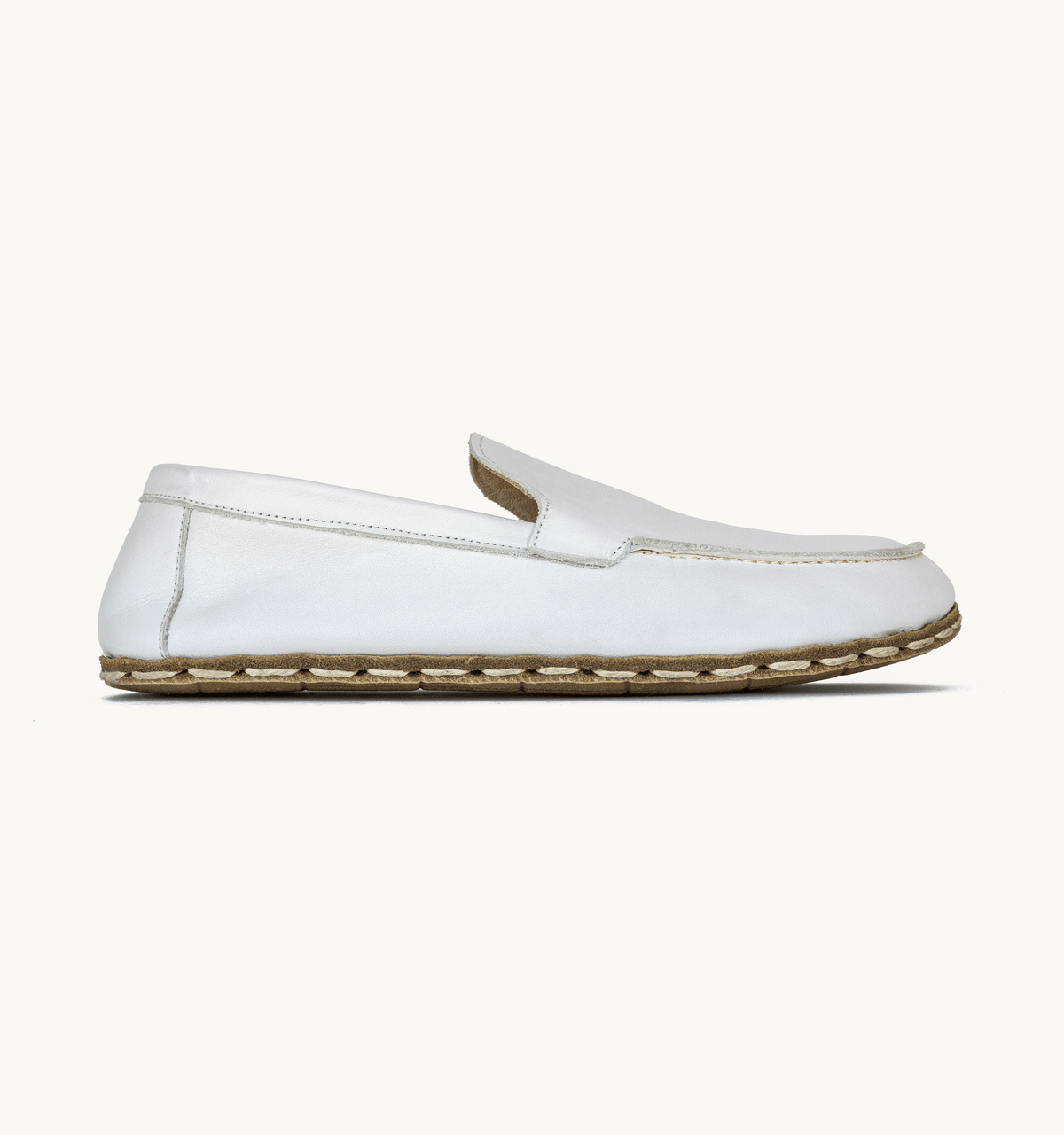 Cloud women's barefoot leather moccasin, side view — hand-stitched, zero drop