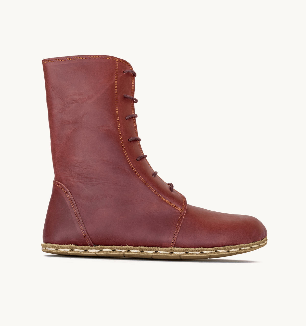 Burgundy women's barefoot leather ankle boot, side view — hand-stitched, zero drop