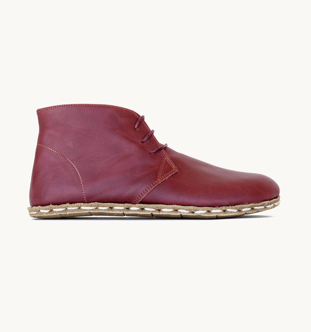 Burgundy women's barefoot leather chukka boot, side view — hand-stitched, zero drop