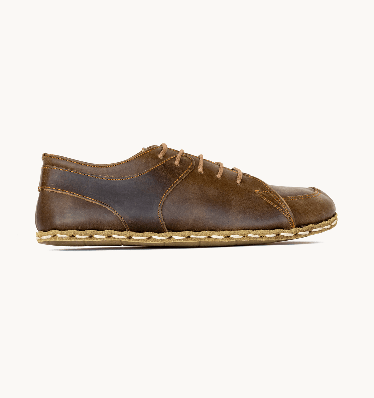 Earth men's barefoot leather sneaker, side view — hand-stitched, zero drop