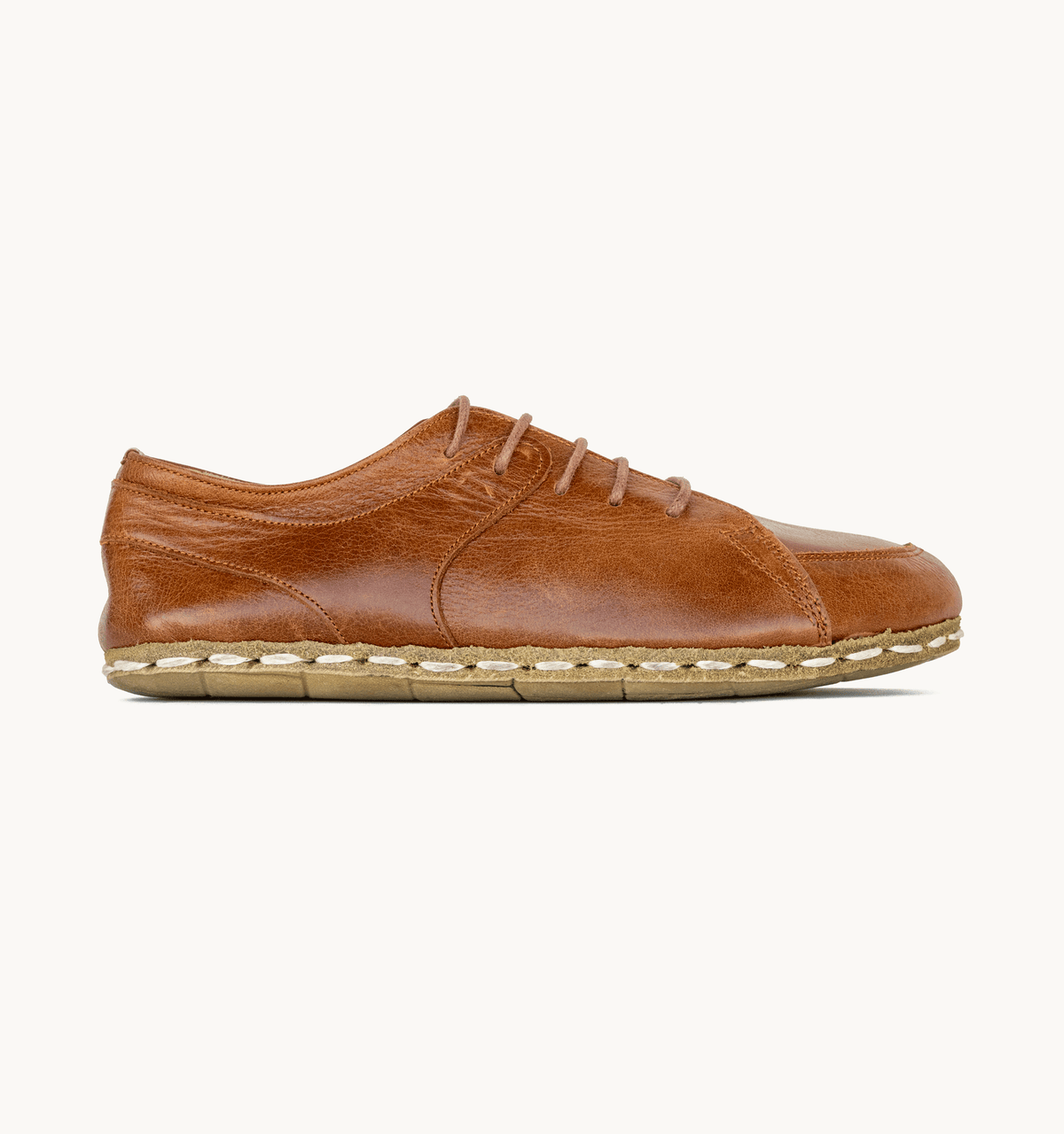 Russet men's barefoot leather sneaker, side view — hand-stitched, zero drop