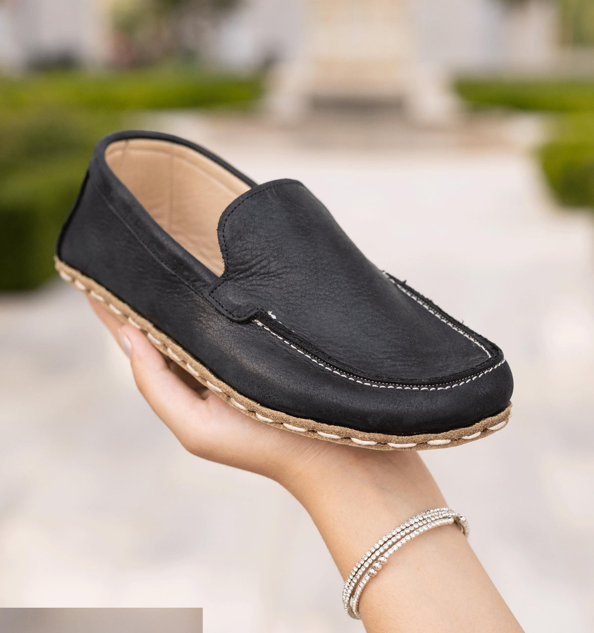 Raven Black barefoot moccasin for women — buffalo leather sole with copper grounding rivet